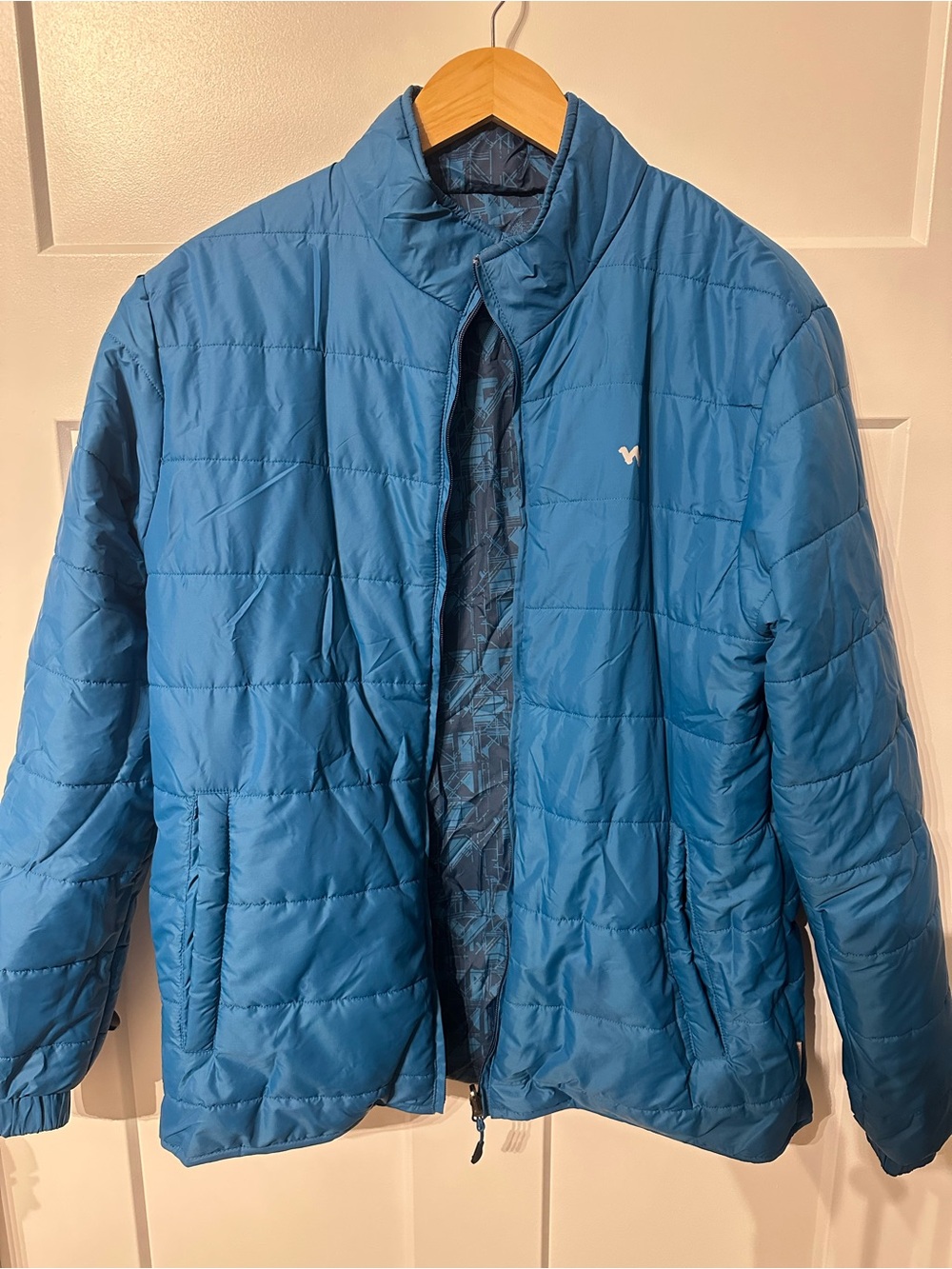Men’s Reversible Blue quilted puffer jacket with abstract geometric pattern